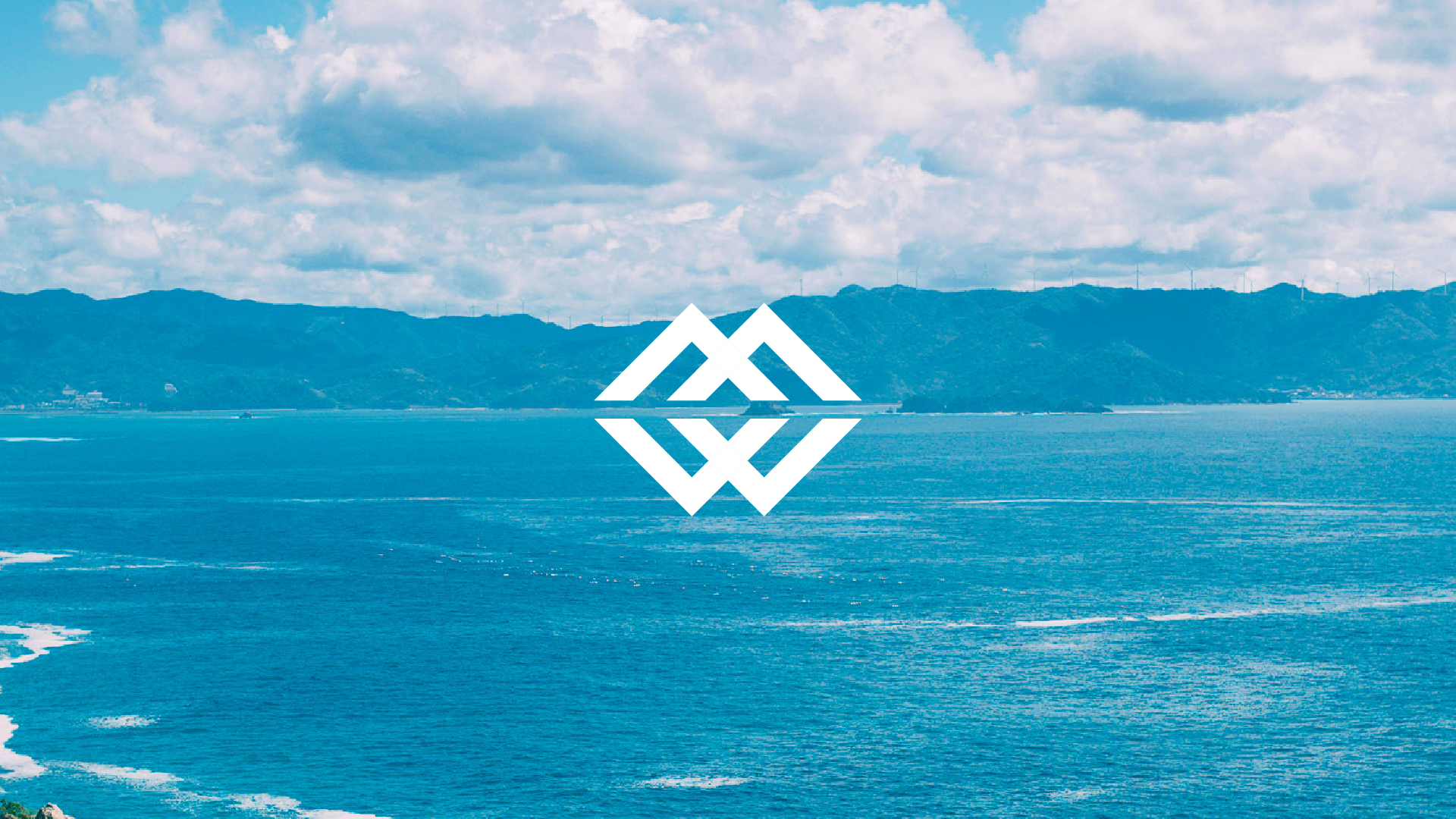 WCPCのロゴ、和歌山の山水を背景に