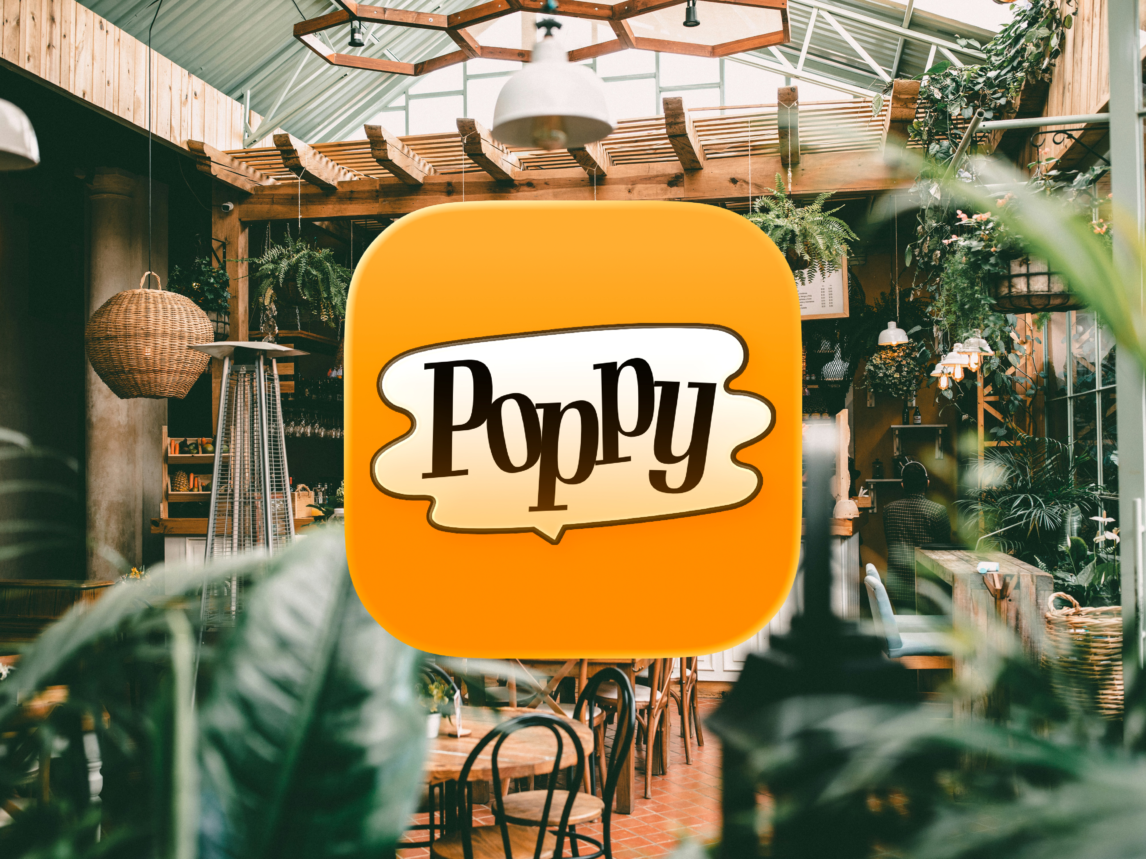 Poppyのアプリアイコンイメージ、カフェの写真を背景に